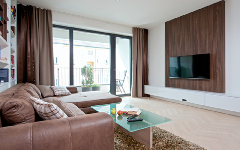 Praktický a moderní návrh obývací pokoj studia ZAKI Design